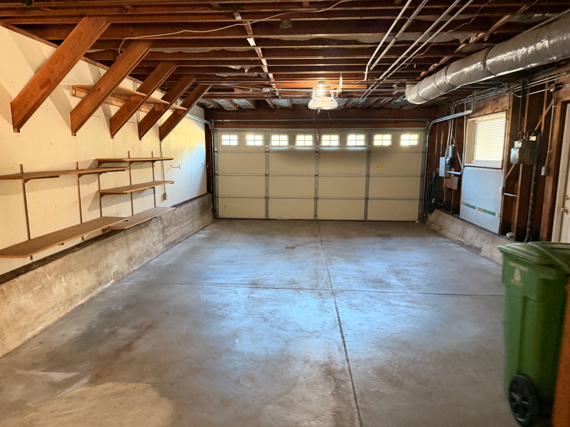 Double-car garage with shelving and workshop space